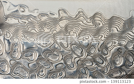 Macro surface of the Damascus steel blade with a unique wavy pattern 139113123