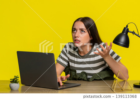 Woman angrily typing then slamming laptop shut frustrated by error bug or system crash at table Woman angrily typing then slamming laptop shut frustrated by error bug or system crash at table 139113368