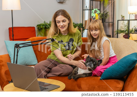 Mother daughter dog podcast with studio microphone pet care tips family hacks live talk record show 139113455