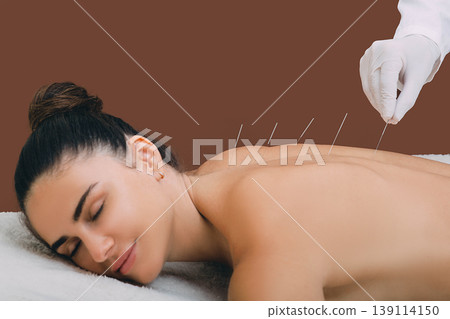 woman relaxes from acupuncture procedure. An acupuncturist doong acupuncture very accurately. Traditional chinese medicine woman relaxes from acupuncture procedure. An acupuncturist doong acupuncture very accurately. Traditional chinese medicine 139114150