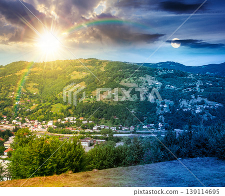 day meet night. carpathian mountain landscape in summer. view in to the valley of rakhiv town near forested hill of mountain range. astrology background of alpine ukraine countryside. harmony concept day meet night. carpathian mountain landscape in summer. view in to the valley of rakhiv town near forested hill of mountain range. astrology background of alpine ukraine countryside. harmony concept 139114695