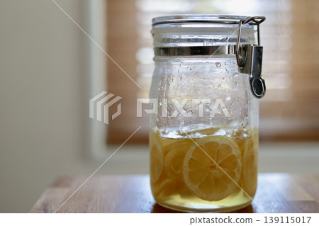 Homemade lemon syrup made in a sealed jar Homemade lemon syrup made in a sealed jar 139115017
