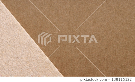 Brown and beige kraft paper layered on a diagonal for a minimal eco packaging background Brown and beige kraft paper layered on a diagonal for a minimal eco packaging background 139115122