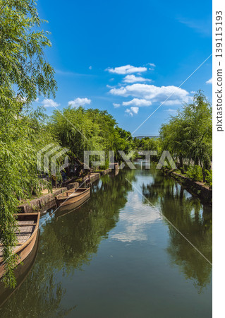 Riverboats floating on the canals of the Kurashiki Bikan Historical Quarter Riverboats floating on the canals of the Kurashiki Bikan Historical Quarter 139115193