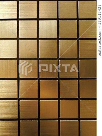 Abstract background of golden brushed metal square tiles. Minimalist geometric mosaic pattern with gold metallic texture and grout lines Luxury design Abstract background of golden brushed metal square tiles. Minimalist geometric mosaic pattern with gold metallic texture and grout lines Luxury design 139115422