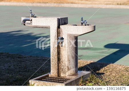 Upward-facing drinking faucet in the park Upward-facing drinking faucet in the park 139116875