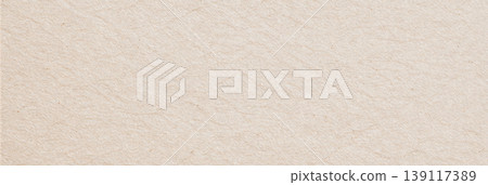Beige recycled paper displaying a textured surface with slight creases and visible fiber details Beige recycled paper displaying a textured surface with slight creases and visible fiber details 139117389