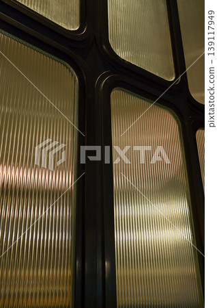 Close-up of the glass wall inside the home. Home decoration, home interiors. Home design elements. For background use. Close-up of the glass wall inside the home. Home decoration, home interiors. Home design elements. For background use. 139117949