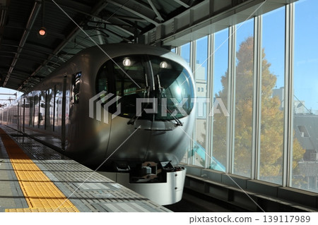 The LAVIEW train speeds through the landscape with ginkgo trees in the background. The LAVIEW train speeds through the landscape with ginkgo trees in the background. 139117989