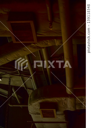 Close-up of the pipe in the buildings. Rusted pipe in the building. Building feature, industry concept. 139118348