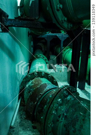 Close-up of the pipe in the buildings. Rusted pipe in the building. Building feature, industry concept. 139118349