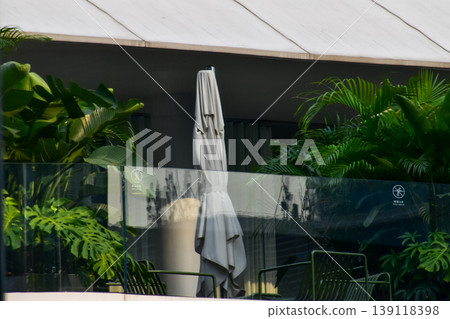Close-up of the balcony of the building. Cafe scene.  139118398