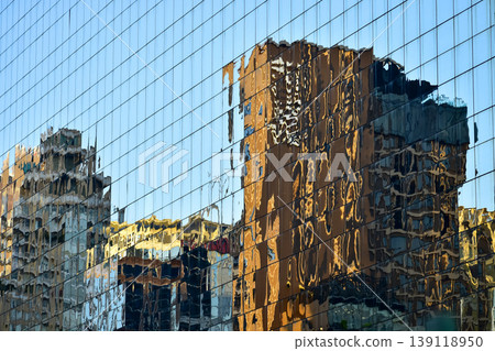 Reflection of business buildings on modern office building wall.Details of modern architecture. Building abstract. Reflection of business buildings on modern office building wall.Details of modern architecture. Building abstract. 139118950