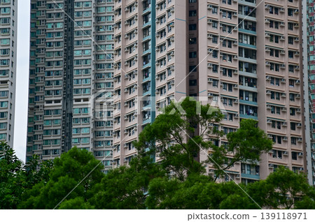 Exterior of residential building in Hong Kong. Details of modern architecture. Building abstract. Building background. Exterior of residential building in Hong Kong. Details of modern architecture. Building abstract. Building background. 139118971