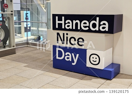 Haneda Nice Day sign. It is a famous photo spot located within Haneda Airport in Tokyo, Japan Haneda Nice Day sign. It is a famous photo spot located within Haneda Airport in Tokyo, Japan 139120175