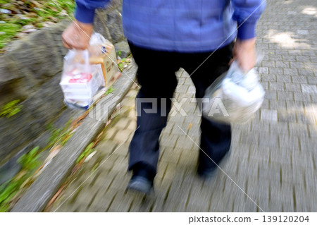 The urban landscape of Yokohama, Japan; natto, sliced bread, pickled vegetables... an aging society... an elderly man returning from shopping... dietary habits... what is life...? 139120204