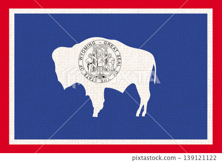 Flag of Wyoming state on fabric surface. Colored Wyoming flag on fabric Flag of Wyoming state on fabric surface. Colored Wyoming flag on fabric 139121122