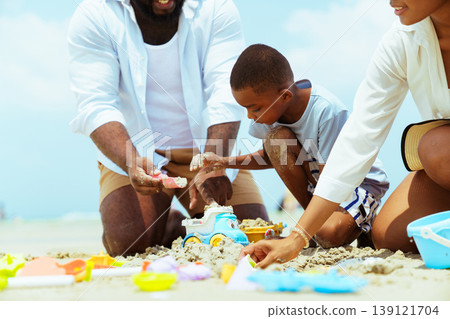 Happy Family Playing with Sand Toys on Sunny Beach Summer Vacation 139121704