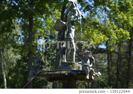 Fountain with figures in a city park Fountain with figures in a city park 139122944