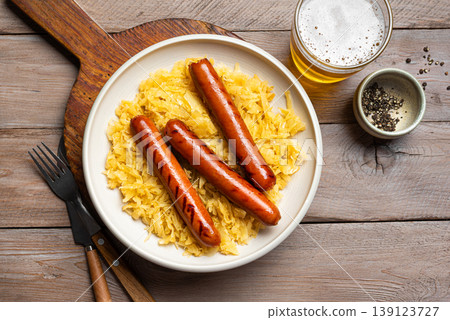 German Bratwurst meal with Sauerkraut and Beer German Bratwurst meal with Sauerkraut and Beer 139123727