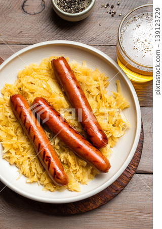 Bavarian Bratwurst meal with Sauerkraut and Beer Bavarian Bratwurst meal with Sauerkraut and Beer 139123729