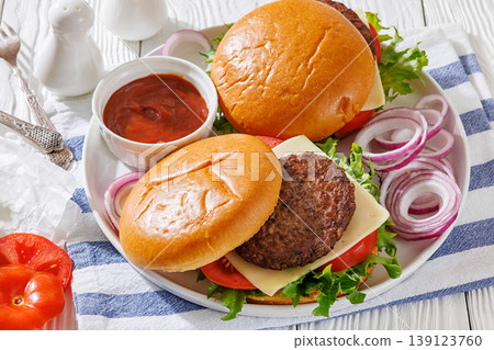 Beef cheeseburgers with brioche buns on a plate 139123760