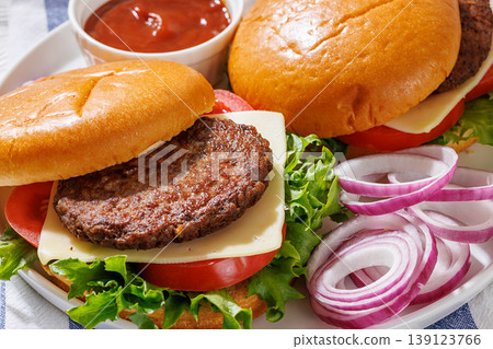 Beef cheeseburgers with brioche buns on a plate 139123766