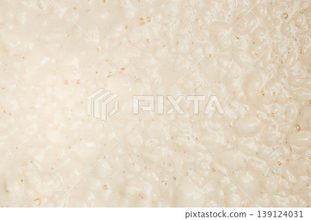 Raw dough texture background with bubbles and uneven surface top view 139124031