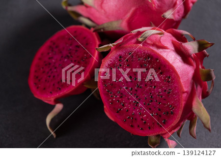 Dragon fruit on a grey granite background. Dragon fruit on a grey granite background. 139124127