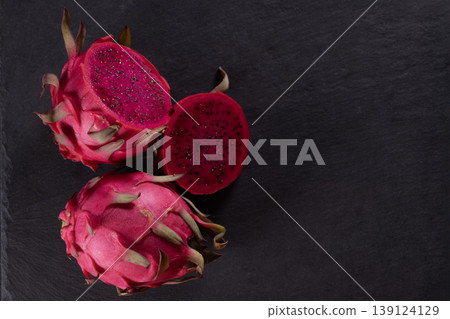 Dragon fruit on a grey granite background. Dragon fruit on a grey granite background. 139124129