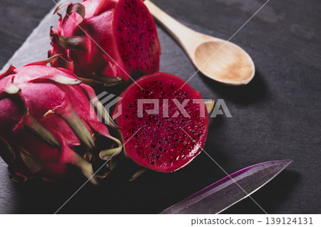Dragon fruit on a grey granite background. Dragon fruit on a grey granite background. 139124131