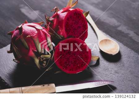 Dragon fruit on a grey granite background. Dragon fruit on a grey granite background. 139124132