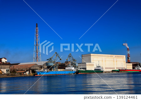 Cargo transportation and activity at steel factory shipping terminal in Kitakyushu, Japan. Cargo transportation and activity at steel factory shipping terminal in Kitakyushu, Japan. 139124461