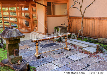 The  Movable bamboo fence forbids from approaching the walkway. 139124485