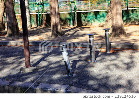 Retractable hydraulic bollard point ( Car barrier ) In operate on street pavement Retractable hydraulic bollard point ( Car barrier ) In operate on street pavement 139124530