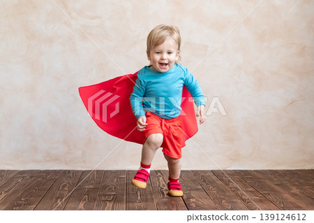 Little boy dressed as a superhero having fun at home Little boy dressed as a superhero having fun at home 139124612