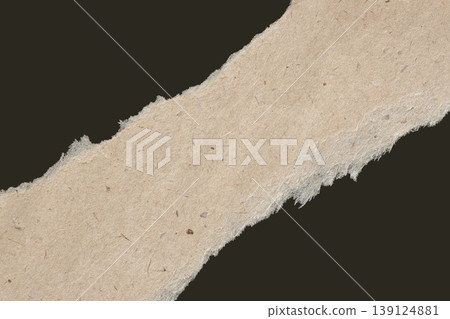 Torn craft paper strip with rough edges and fibrous texture isolated on dark background, highlighting natural paper detail. Natural background of paper texture, recycled material, paper design element Torn craft paper strip with rough edges and fibrous texture isolated on dark background, highlighting natural paper detail. Natural background of paper texture, recycled material, paper design element 139124881