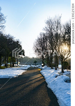 Snowscape and contrails at Ishikawa Fourth High School Memorial Park 139125304