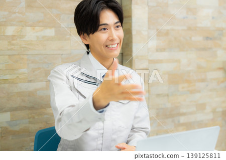 A businessman wearing work clothes A businessman wearing work clothes 139125811