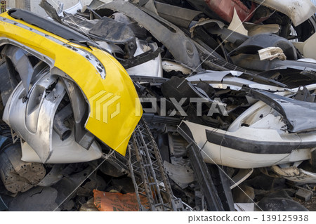 Old and damaged car bumpers collected for recycling. Old and damaged car bumpers collected for recycling. 139125938