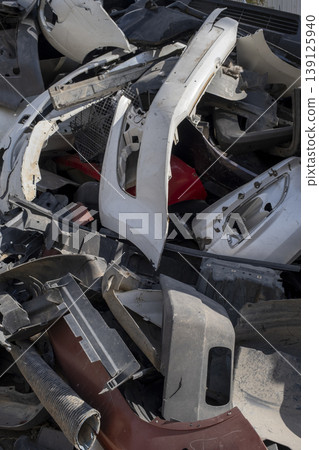 Old and damaged car bumpers collected for recycling. Old and damaged car bumpers collected for recycling. 139125940