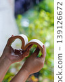 Hands holding open book shaped as heart, love reading concept 139126672