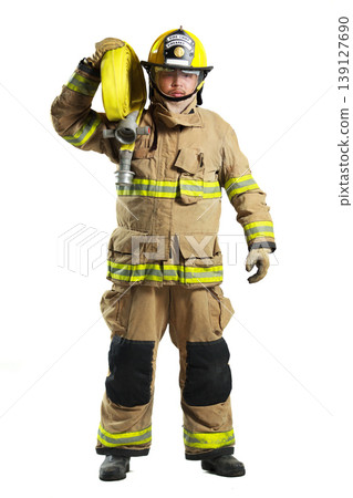 Firefighter in full protective suit carrying fire hose Firefighter in full protective suit carrying fire hose 139127690