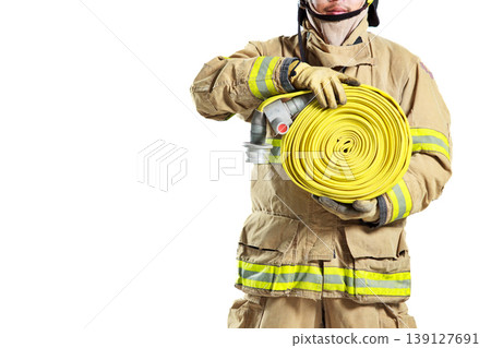 Firefighter in protective uniform holding a fire hose roll Firefighter in protective uniform holding a fire hose roll 139127691
