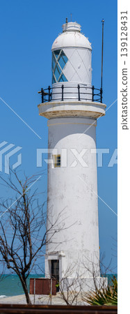 White lighthouse at Talaimannar, Sri Lanka, standing by the Indian Ocean with clear blue sky in bright daylight White lighthouse at Talaimannar, Sri Lanka, standing by the Indian Ocean with clear blue sky in bright daylight 139128431