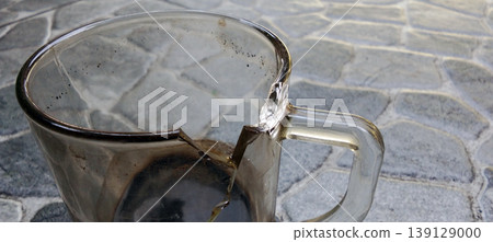 Broken Glass with Scorch Marks on the Floor Surface Broken Glass with Scorch Marks on the Floor Surface 139129000