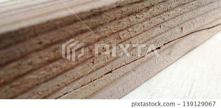 Close up of a stack of naturally textured wood planks. Close up of a stack of naturally textured wood planks. 139129067