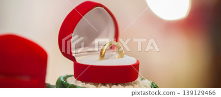 Groom show wedding ring on the box before give to bride in wedding ceremony. Groom show wedding ring on the box before give to bride in wedding ceremony. 139129466