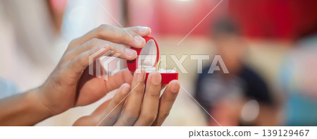 Groom show wedding ring on the box before give to bride in wedding ceremony.  139129467