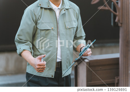 A contractor rings the doorbell. A contractor rings the doorbell. 139129891